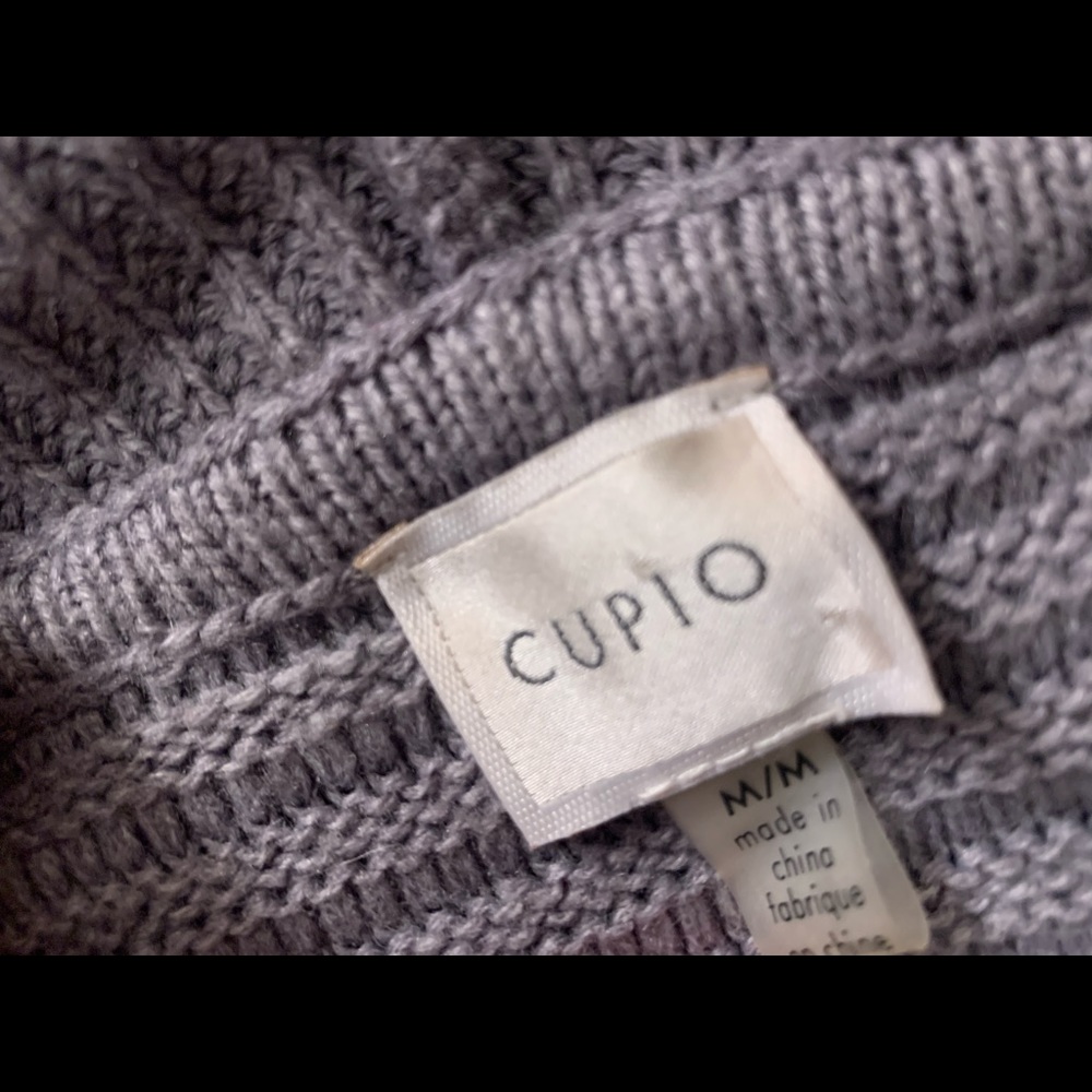 Long, cable knit cardigan sweater